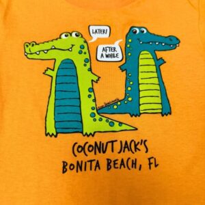 A yellow shirt with two crocodiles talking to each other.