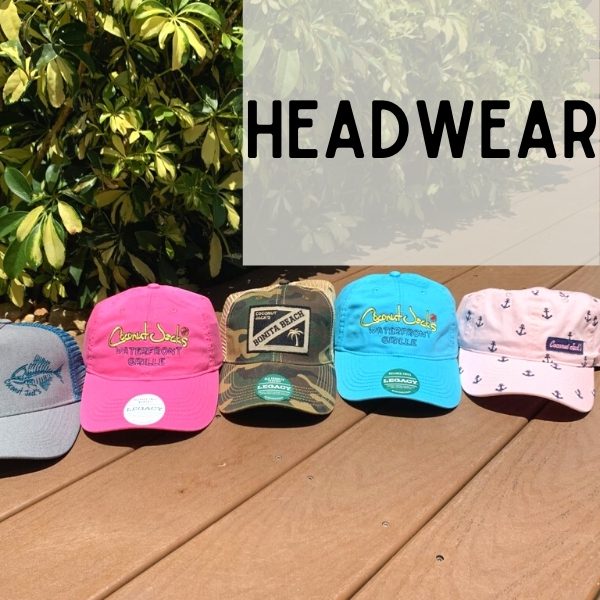 A group of hats sitting on top of a wooden table.