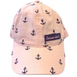 A pink hat with black anchors on it.