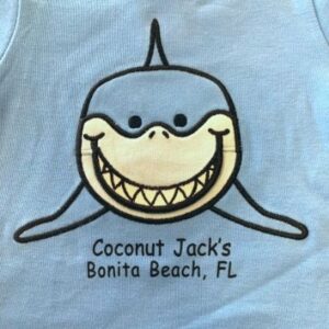 A blue shirt with a shark on it