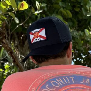 A man wearing a hat with the state of florida on it.