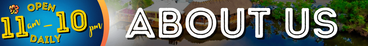 A white sign that says abc in front of a building.