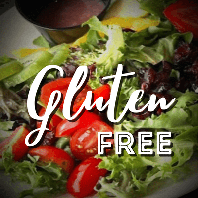 A plate of food with lettuce and tomatoes on it.