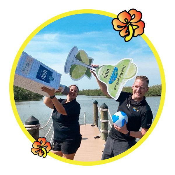 Two men holding a kite board and ball