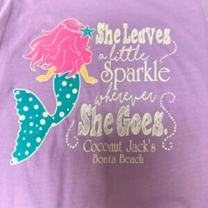 A purple shirt with a mermaid and quote