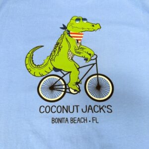 A close up of the front of a shirt with a picture of a crocodile on it