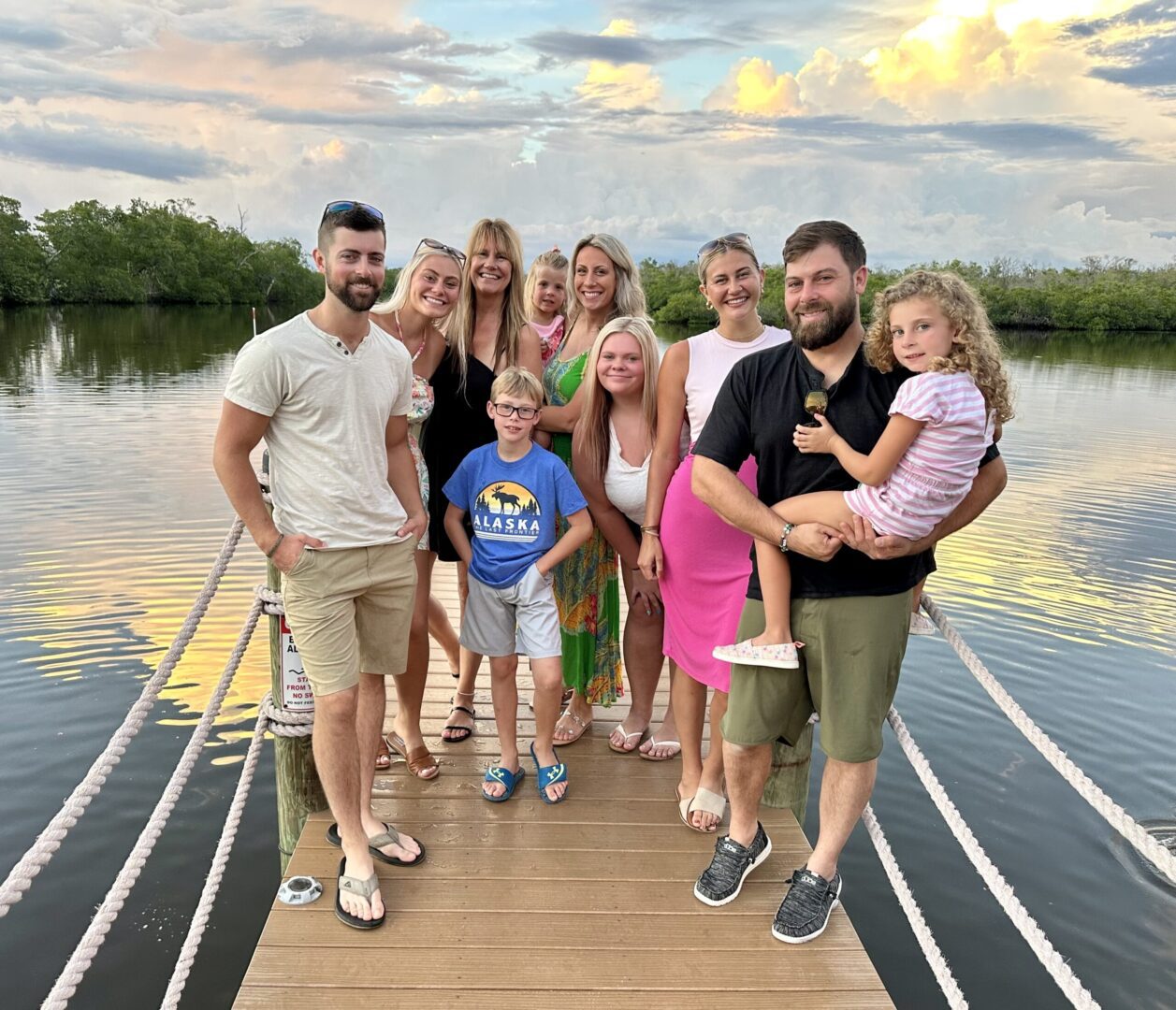 A group of people standing on the dock