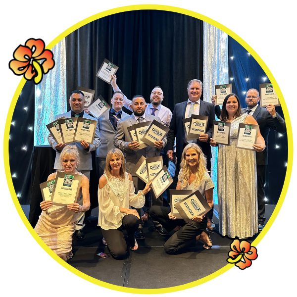 A group of people holding up books in front of a circle.