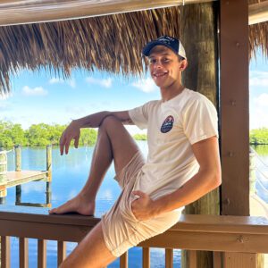 A man sitting on the porch of his home.