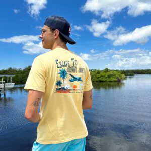 A man standing in front of the water.