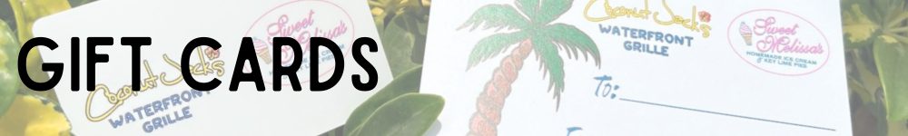 A close up of a plant and some palm trees